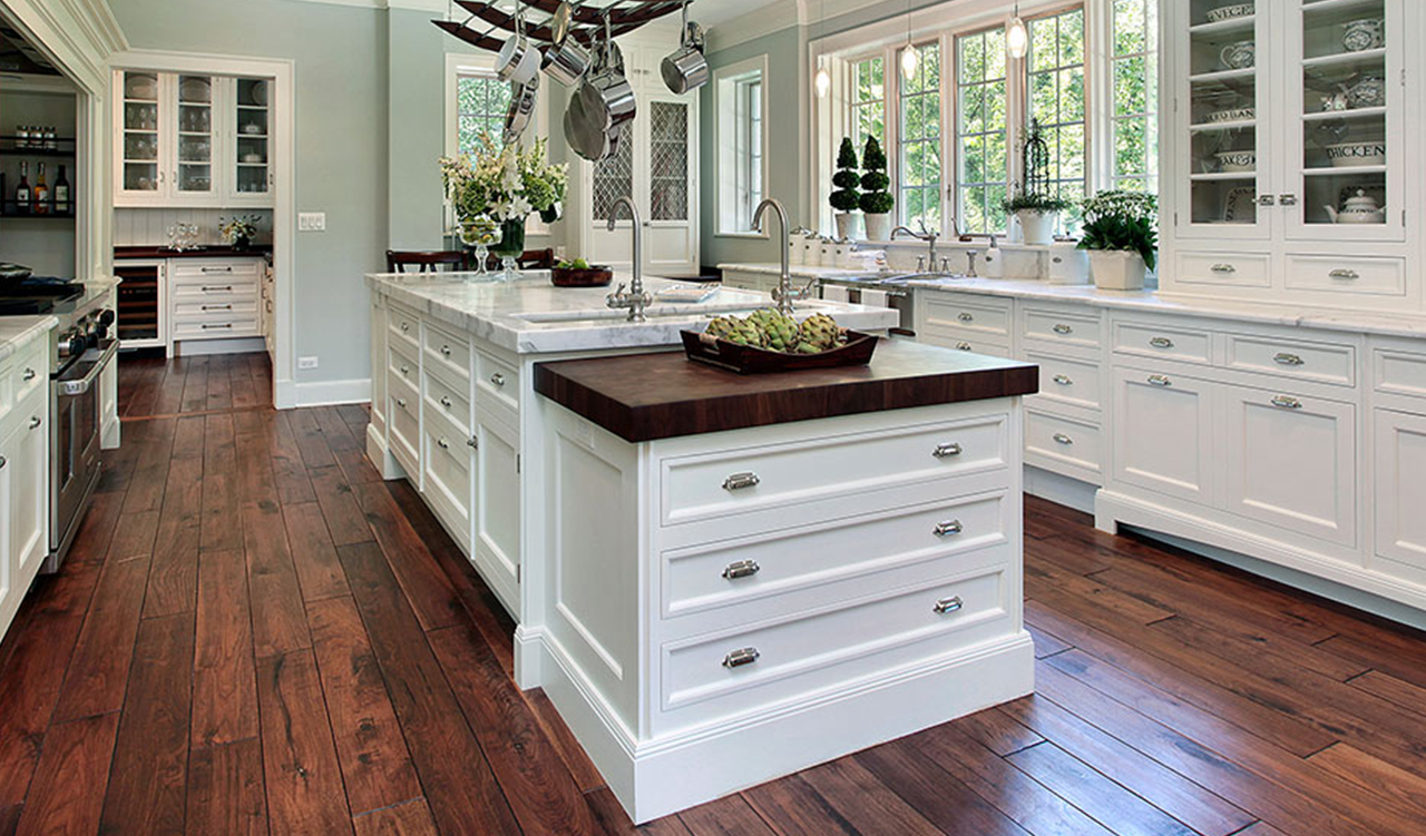 Modern Kitchen Remodel with hardwood floors, white cabinets, and granite countertops